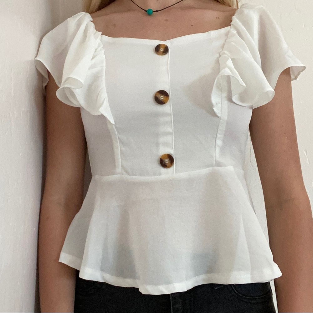 A flowy white crop top